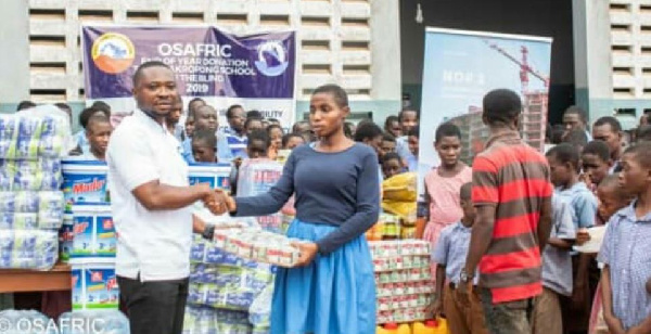 OSAFRIC official hands over items to the school