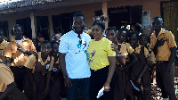 Actor, Adjetey Anang with Augustina Dedo Didi Adjoka and pupils of La Wireless Cluster of Schools