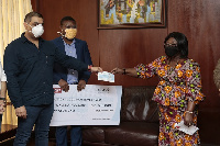 Chief of Staff, Akosua Frema Osei-Opare [R] receiving the cheque