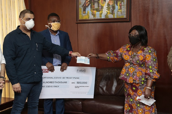 Chief of Staff, Akosua Frema Osei-Opare [R] receiving the cheque