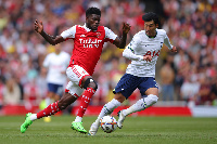 Thomas Partey advances the ball as he is been pressed by Tottenham's Son Heung-min