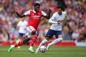 Thomas Partey advances the ball as he is been pressed by Tottenham's Son Heung-min