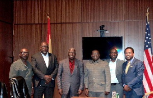 Amb Adjei Bawuah (in red shirt) flanked by journalists