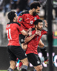 Egyptian players celebrate beating North Africa rivals