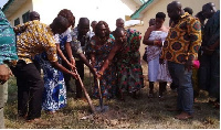 Oti Rgional Minister, Joshua Gmayenaam Makubu and others at the project site