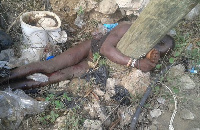 The lifeless body of the suspected thief who was lynched and tied to an electrical pole.