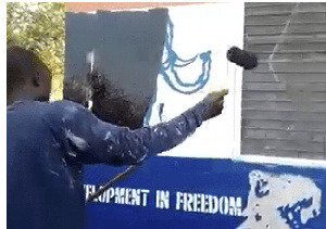 The youth repainting the party office in protest