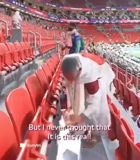 Japanese fans cleaning the stadium