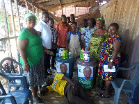 Emmanuel Adotey Allotey with some of the market women