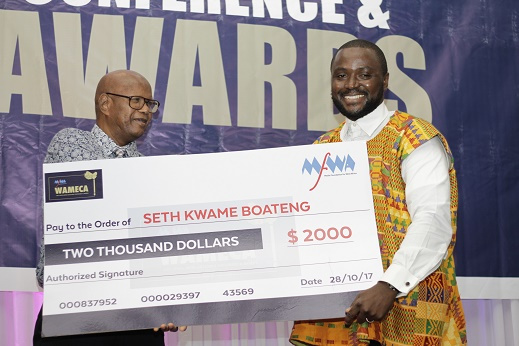 Seth Kwame Boateng [right] receiving the overall West Africa Best Journalist Award.