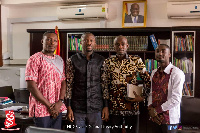 NUGS President (m-r), Ghana Library Authority Acting Ex. Director (m-l) flanked by other officials