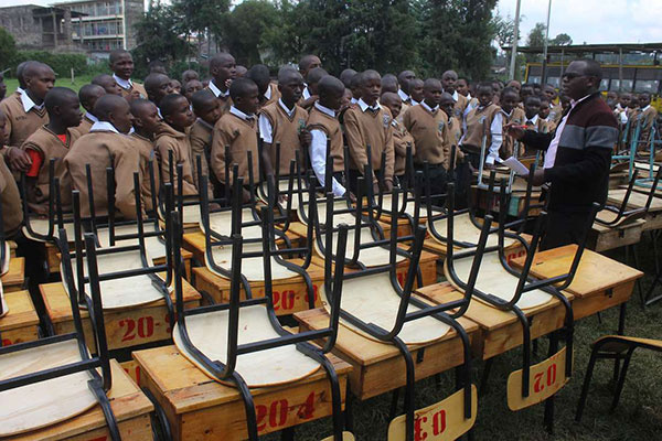 Students being addressed by an authority