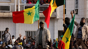 Senegalese opposition leader Ousmane Sonko (centre) greets his supporters as he arrives ahead of his