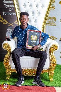 General Manager of Empire Sports Agency, Daniel Boifio Junior with his award