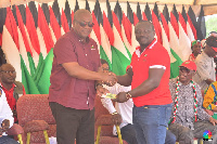 Mr. Alex Kwame Mahama donating to former President John Dramani Mahama