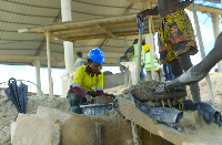 A woman actively involved in a mining process