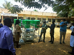 Kobena Mensah Woyome presenting the equipment to the directorate