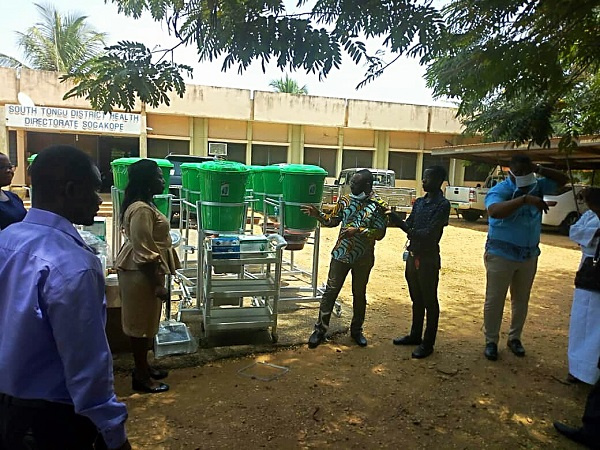 Kobena Mensah Woyome presenting the equipment to the directorate