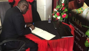 CEO of EIB Bola Ray signing the Book of Condolence