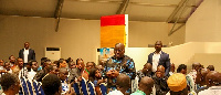 President Akufo-Addo (in glasses) interacts with the press.