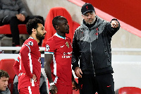 A photo of Mohammed Salah, Sadio Mane and Jurgen Klopp