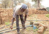 One of the farmers setting up the mechanized borehole to water his farm