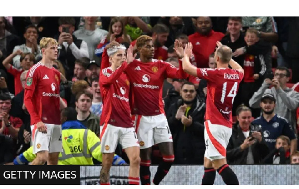 Manchester United striker Marcus Rashford (second right) celebrates scoring against Barnsley