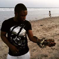 The Lorient forward posted a photo of himself and a python at the beach, on social media