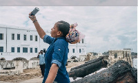 A tourist takes a selfie at Ghana