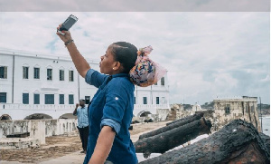 A tourist takes a selfie at Ghana