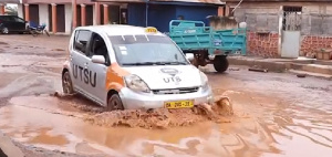 A driver using the deplorable road at Penkwasi