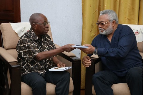 Samuel Ntim Darkwa presenting the book to former President Jerry John Rawlings