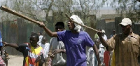 The bus terminal was teeming with machete and club-wielding supporters of both sides