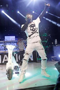 Shatta Wale with the bike on stage