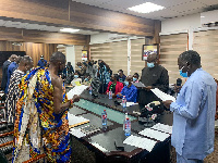 Benito Owusu-Bio swearing in the new board members of the Forest Plantation Development Fund