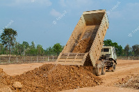 File photo of a truck offloading sand