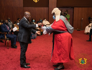 Akufo Addo Presents The Oath Of Office To Justice Prof Henrietta Mensa Bonsu