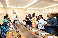 Dr. Amin Adam swearing-in the new board of GRA