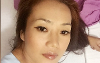 En Huang, 31, is also known as Aisha Huang