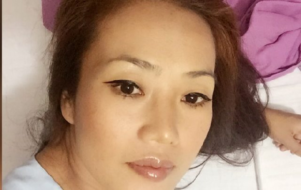 En Huang, 31, a woman, also known as Aisha Huang is part of the alleged five