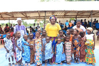 Rev. Dr. Love Konadu with some of the kindergarten children