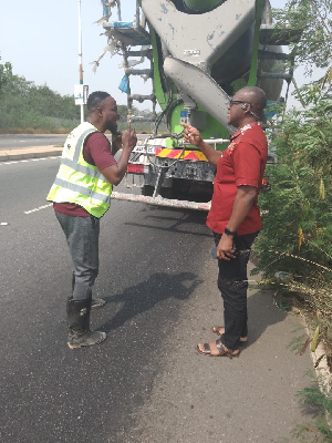 Dr Adam Bonaa confronting the driver of the mobile concrete mixer