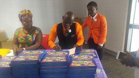 Frank Adjei-Mensah signing an autograph