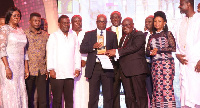 President Akufo-Addo presenting overall best Industrial Company of the year award to Tropical Cables