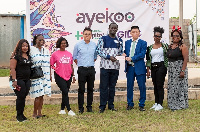 Mr. Xia Dedong (3rd right) presenting the cheque to Mr. Oduro-Mensah