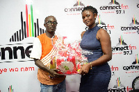 Mr. & Mrs. Prah Bunooh receiving part of their prize package