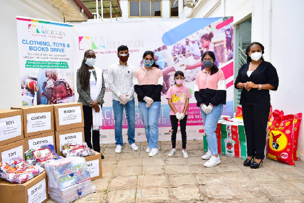 The students in a pose after the donation exercise