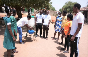 The Team of NABCO's 'Heal Ghana' health professionals demonstrating proper handwashing to the public