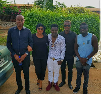 Shatta Wale with the bereave's family