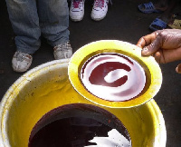 Palm oil being sampled.